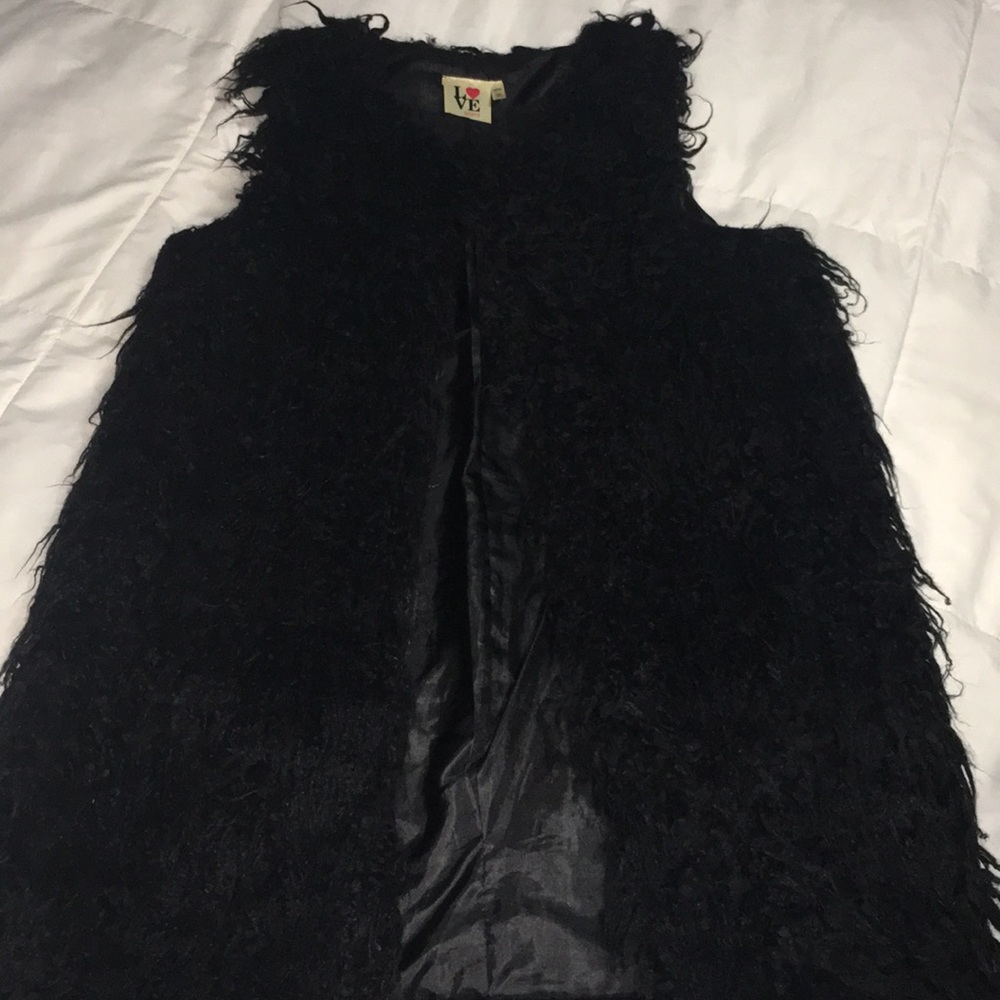 Black furry vest.